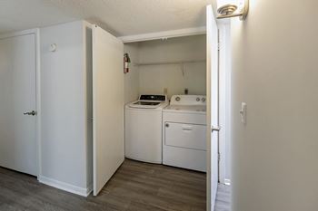A laundry room with a washer and dryer.